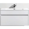 Modern white bathroom vanity with integrated sink and sleek faucet for contemporary bathroom designs.